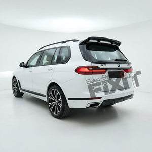 White BMW X7 rear three-quarter view with a black rear spoiler and a large 'Auto Body FIT' watermark overlay, photographed in a white studio setting.