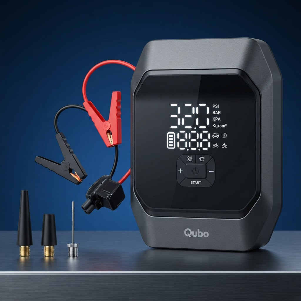 Qubo 4-in-1 jump starter with jump cables, air hose and multi-purpose nozzles laid out